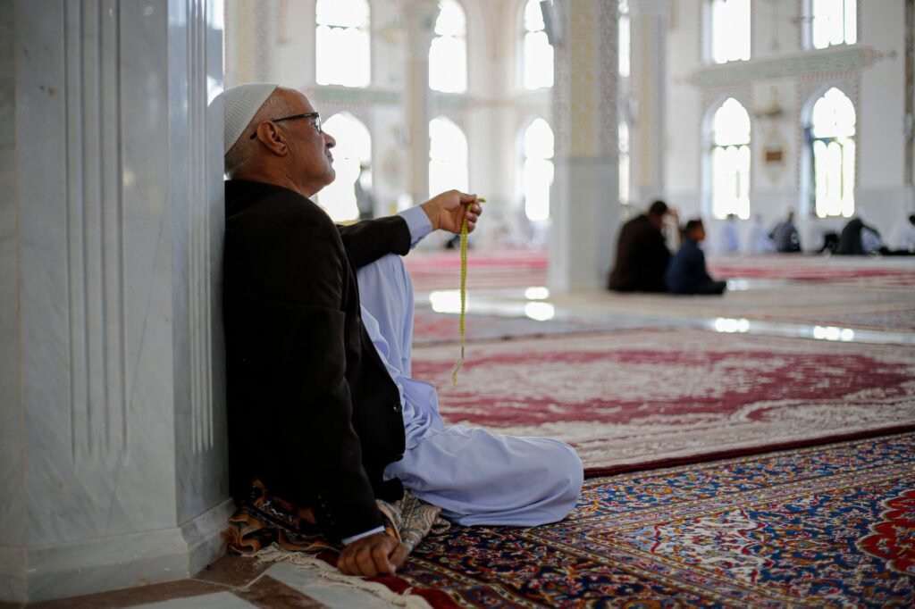 man praying in mosque